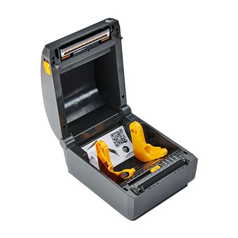 Odprt termični tiskalnik Zebra ZD230 z vidno notranjostjo in držali za etikete